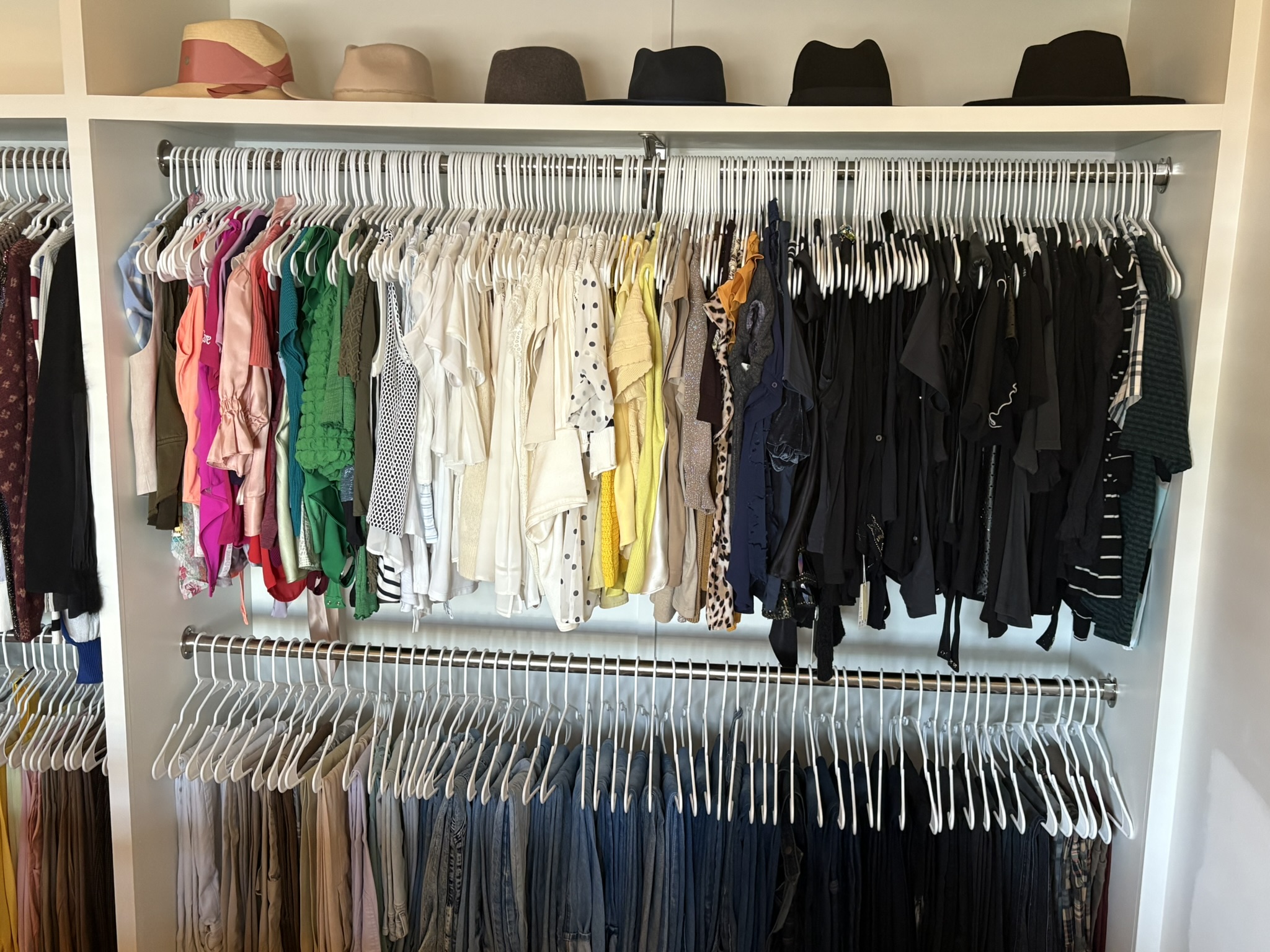 After image of a professionally organized closet featuring women’s blouses and pants neatly hung and color-coordinated for a clean, accessible, and functional wardrobe system by Chaos Coordinator AZ in Arizona.